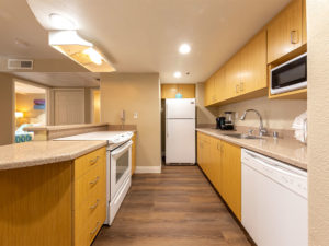 kitchen with full size refrigerator, oven, dishwasher and sink