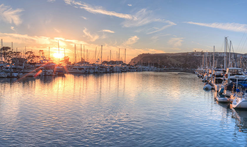 Boats in Dana Point Harbor at sunset